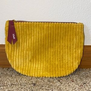 Brand: IPSY. Color: Yellow and maroon.